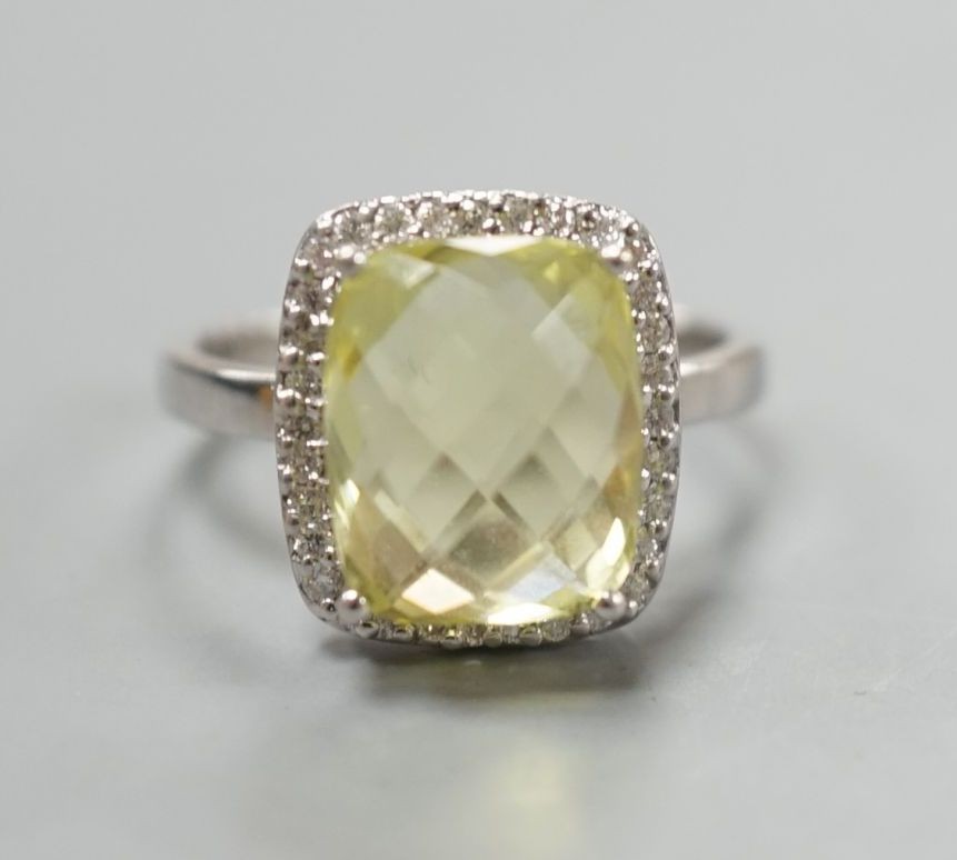 A modern 18ct white gold, fancy cut citrine and diamond cluster set dress ring, size M, gross weight 4.3 grams.